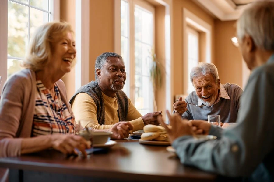 Healthy seniors talking at a table
